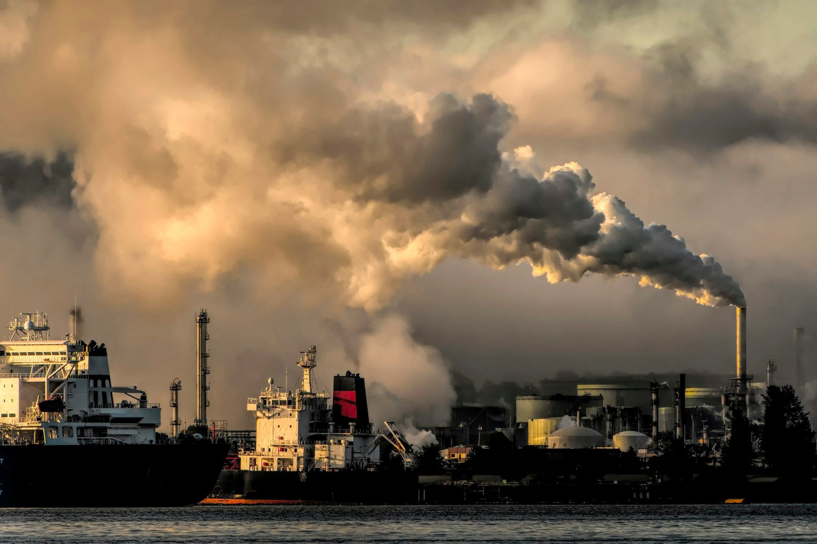 Industrial emissions plume against the sky, representing AeroTraq atmospheric intelligence